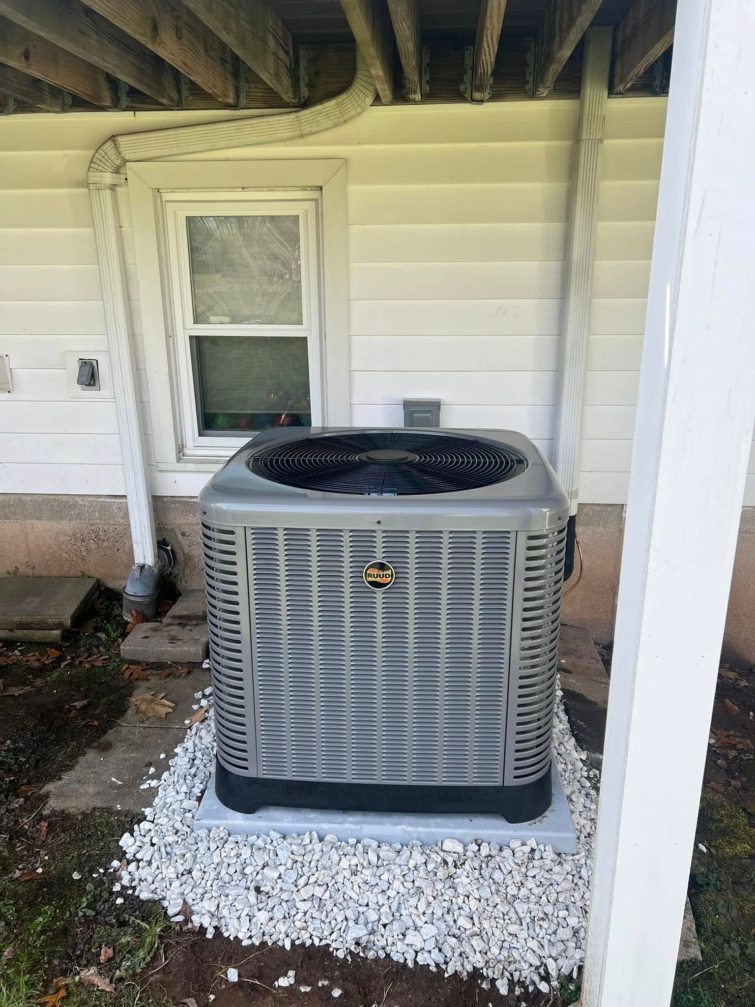 A bunch of silver beads are sitting on top of each other on a blue surface.