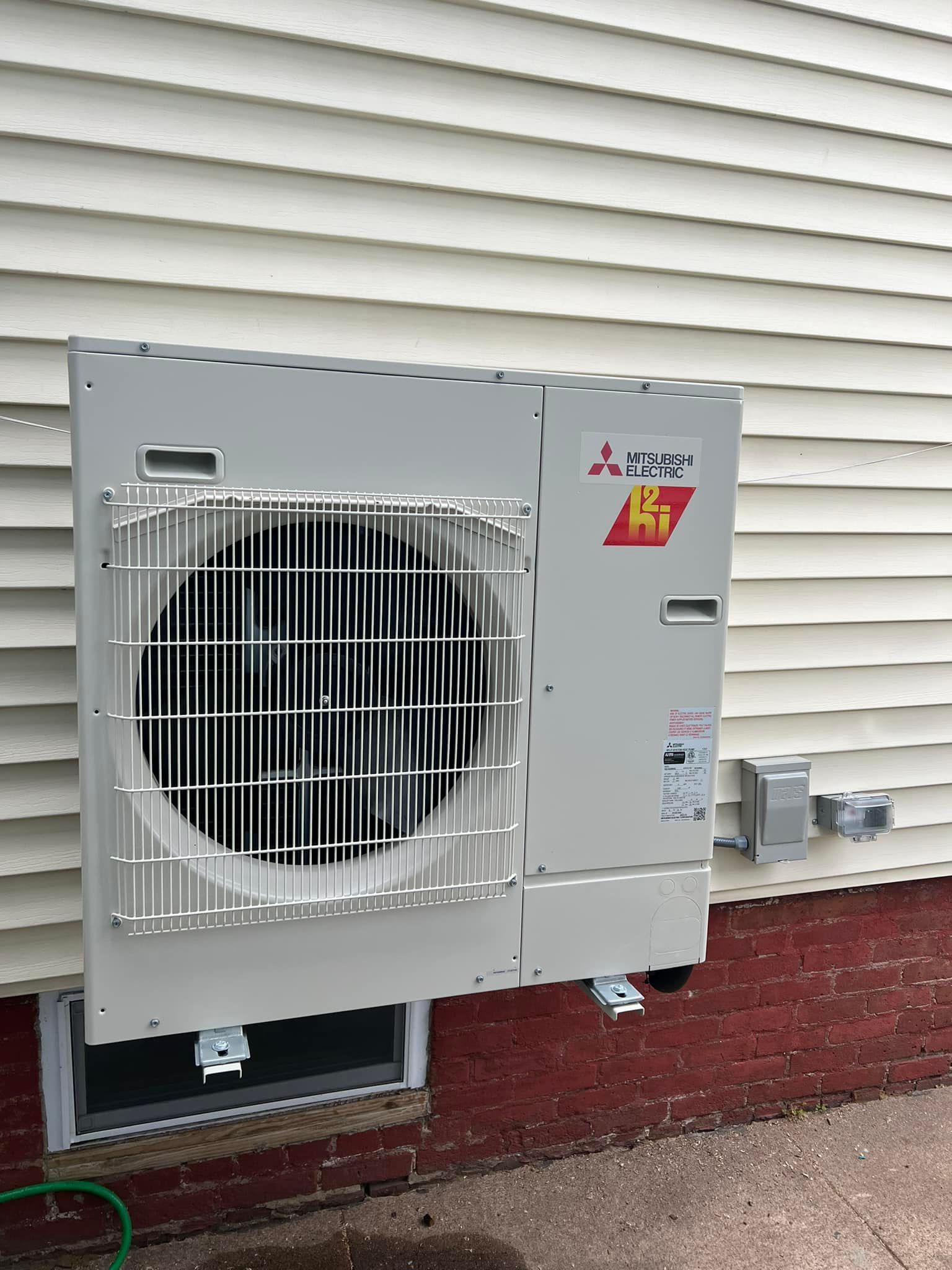 A bunch of silver beads are sitting on top of each other on a blue surface.
