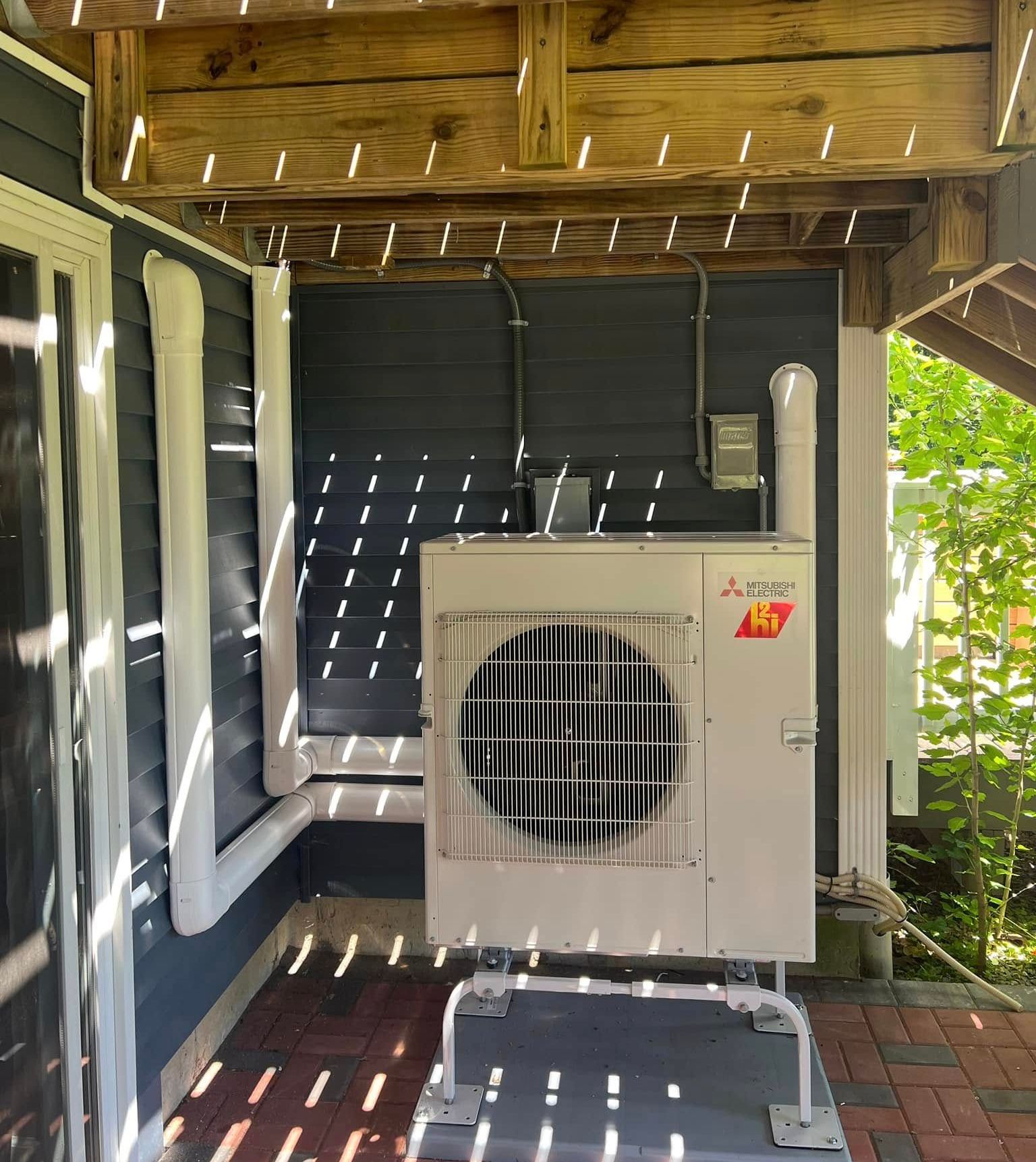 A pile of copper and silver rings on a black surface