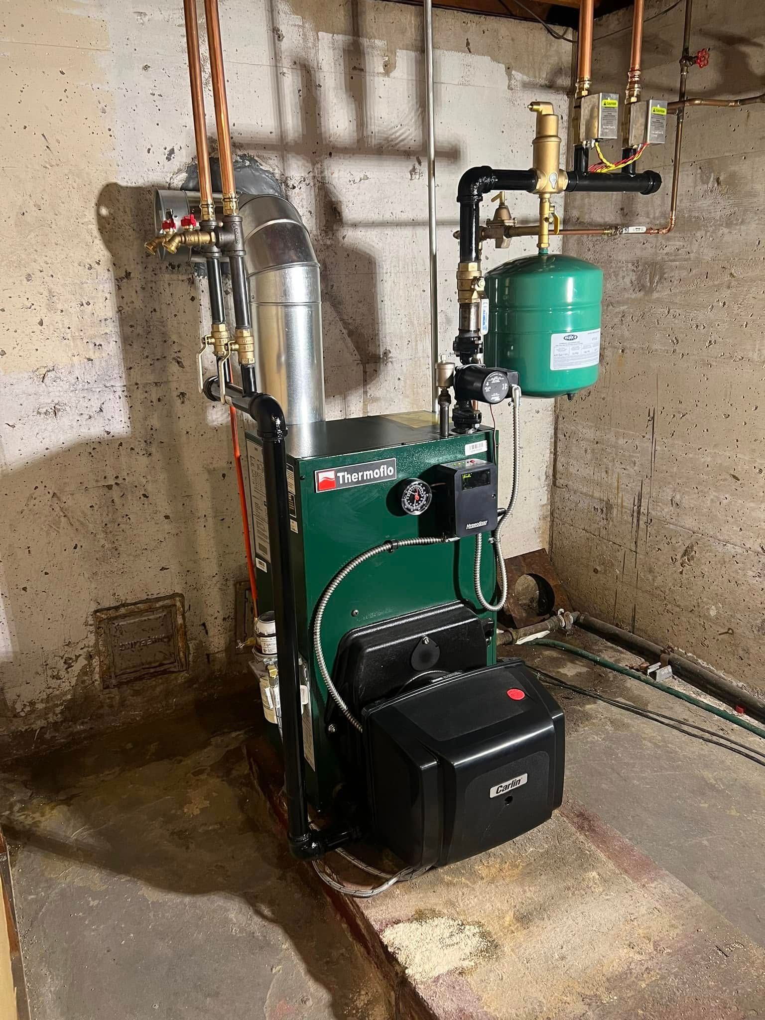 A pile of copper and silver rings on a black surface