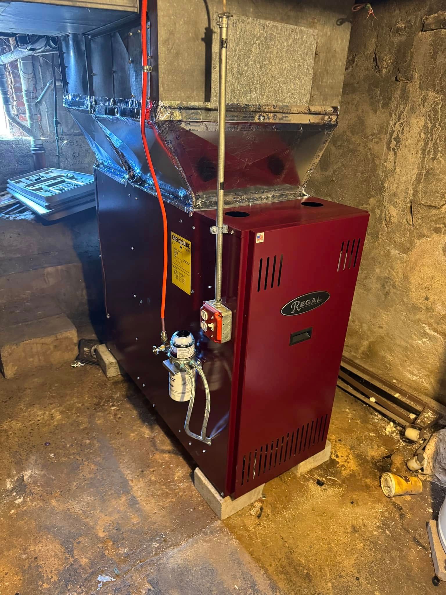 A pair of buttons are sitting on top of a black cloth.