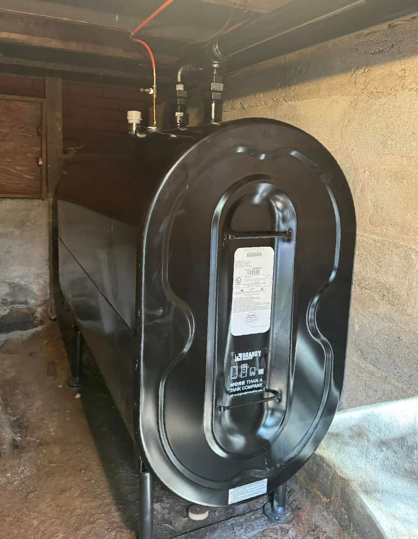 A bunch of silver beads are sitting on top of each other on a blue surface.