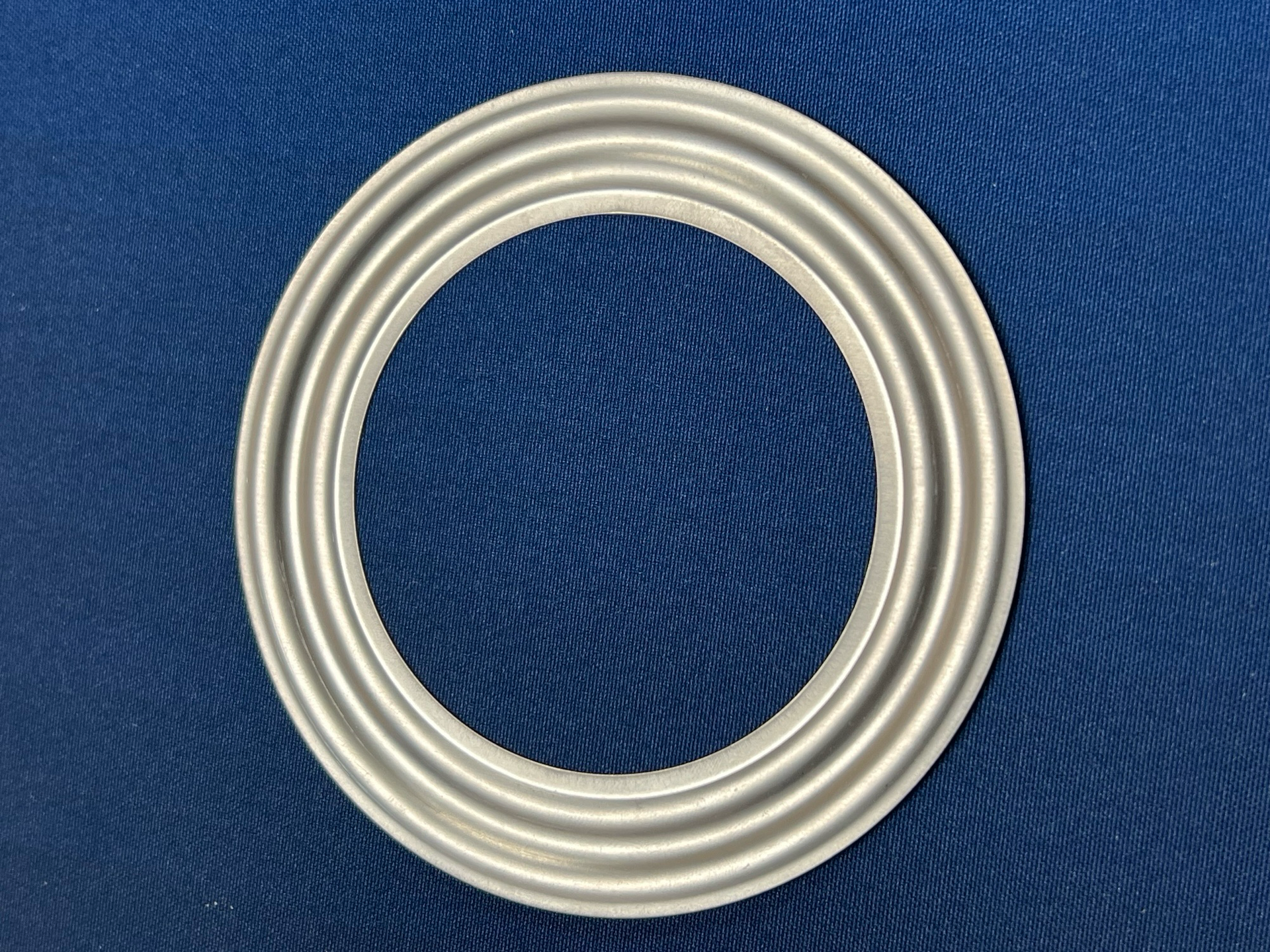 A white circle is sitting on a blue cloth