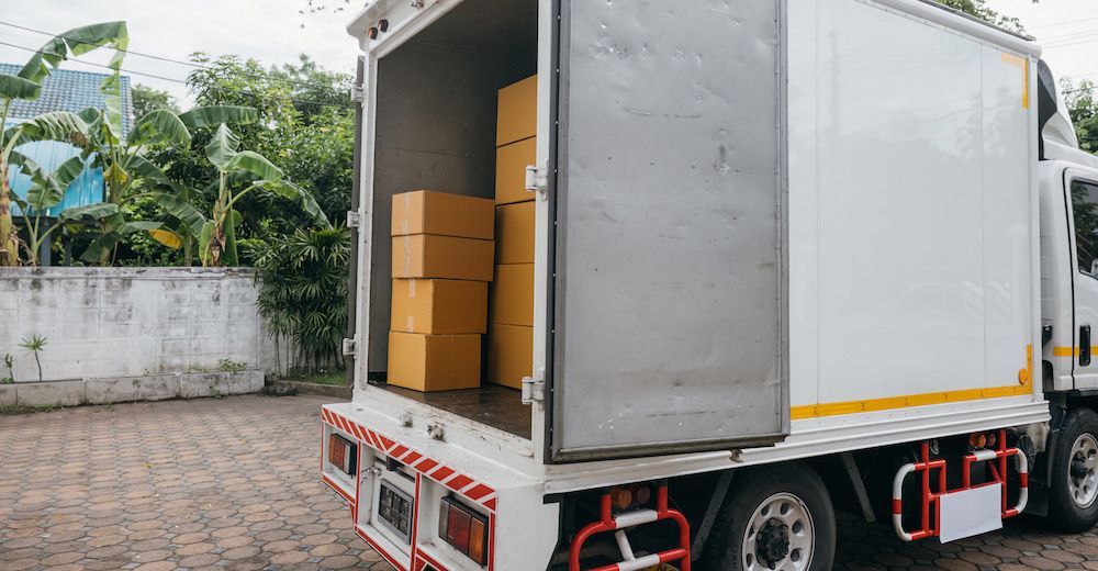A White Van is Parked on the Side of a City Street — Express Couriers Mackay in West Mackay, QLD