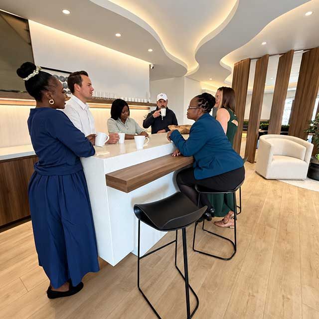 Quintrip team welcoming clients at the reception