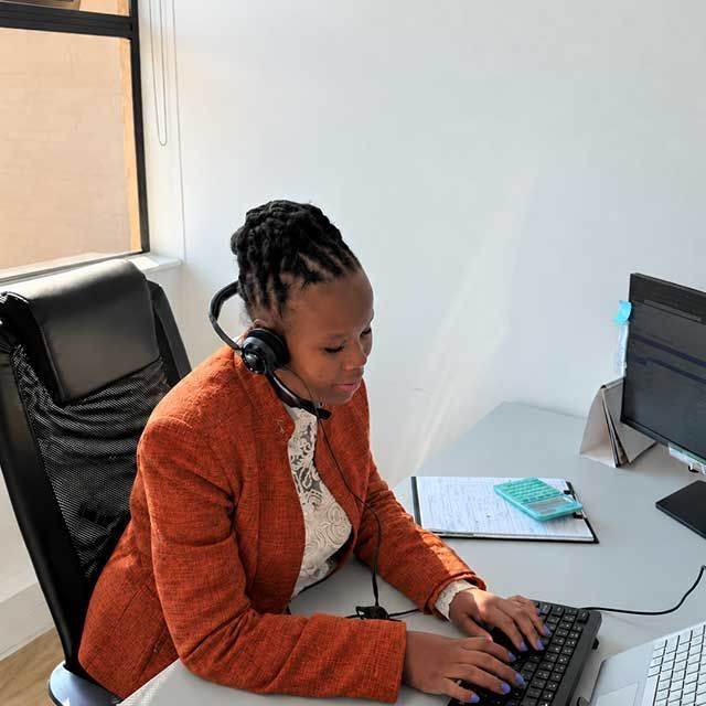 Quintrip consultant on a call in the office