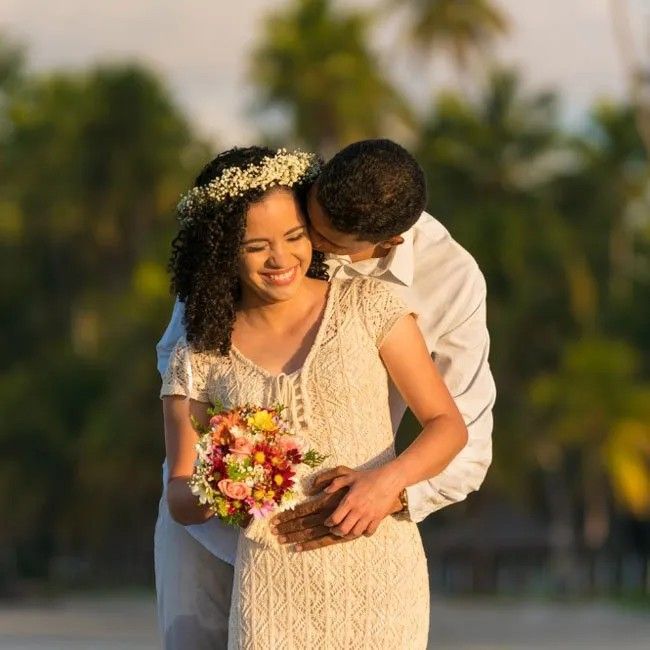 Honeymoon couple with a bouquet