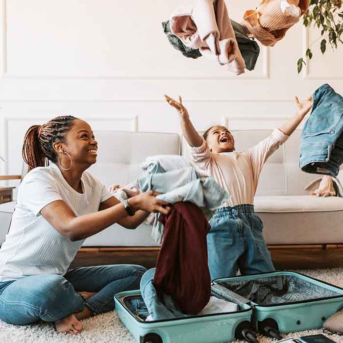 Family packing suitcases for a holiday