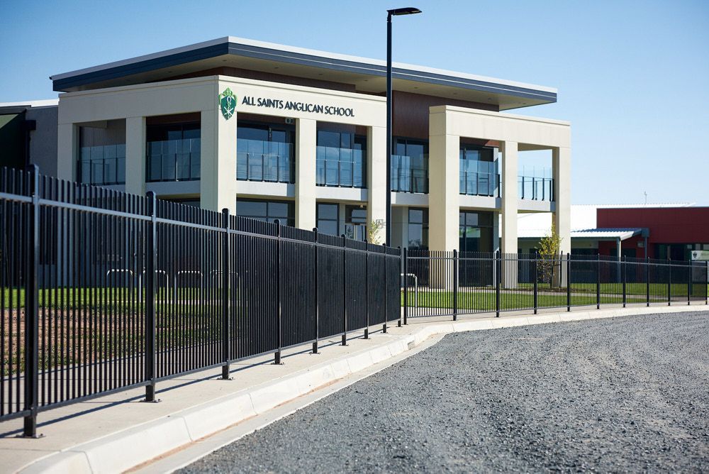 Modern Two-story School Building With Cream Walls and Glass Balconies — Quarrell Civil Construction In Congupna, VIC