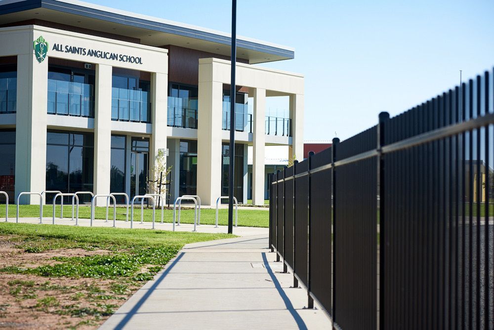A Paved Walkway Leads Toward the Modern Entrance of All Saints Anglican School — Quarrell Civil Construction In Congupna, VIC