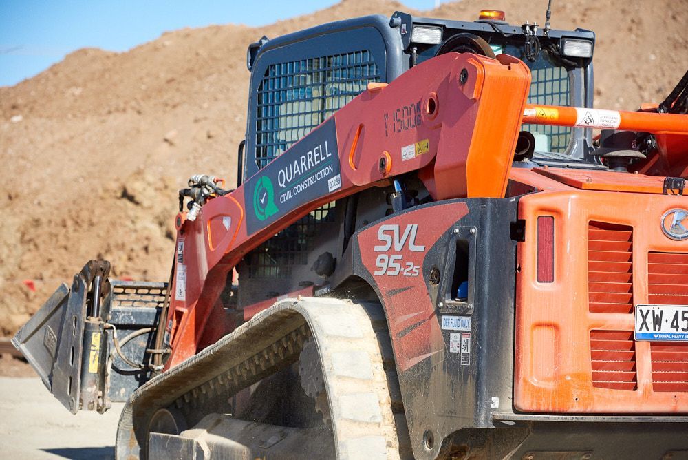 A Red and Black Kubota Svl 95-2s Track Loader Parked on a Construction Site  — Quarrell Civil Construction In Congupna, VIC