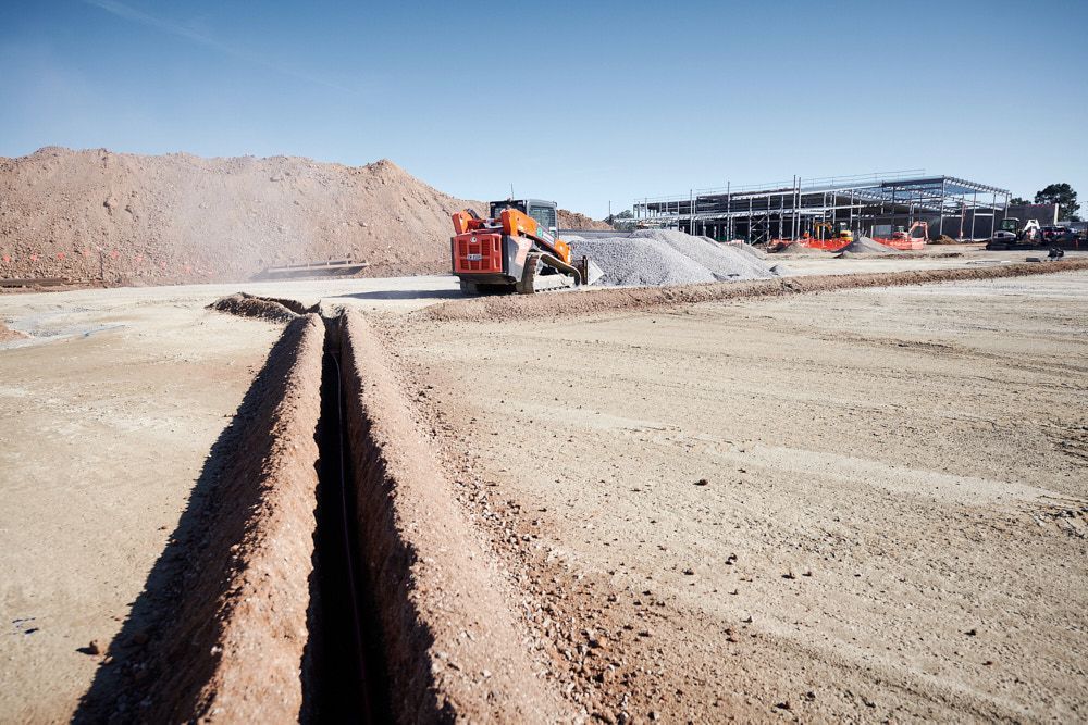 A Wide Shot of a Construction Site With an Open Trench — Quarrell Civil Construction In Congupna, VIC