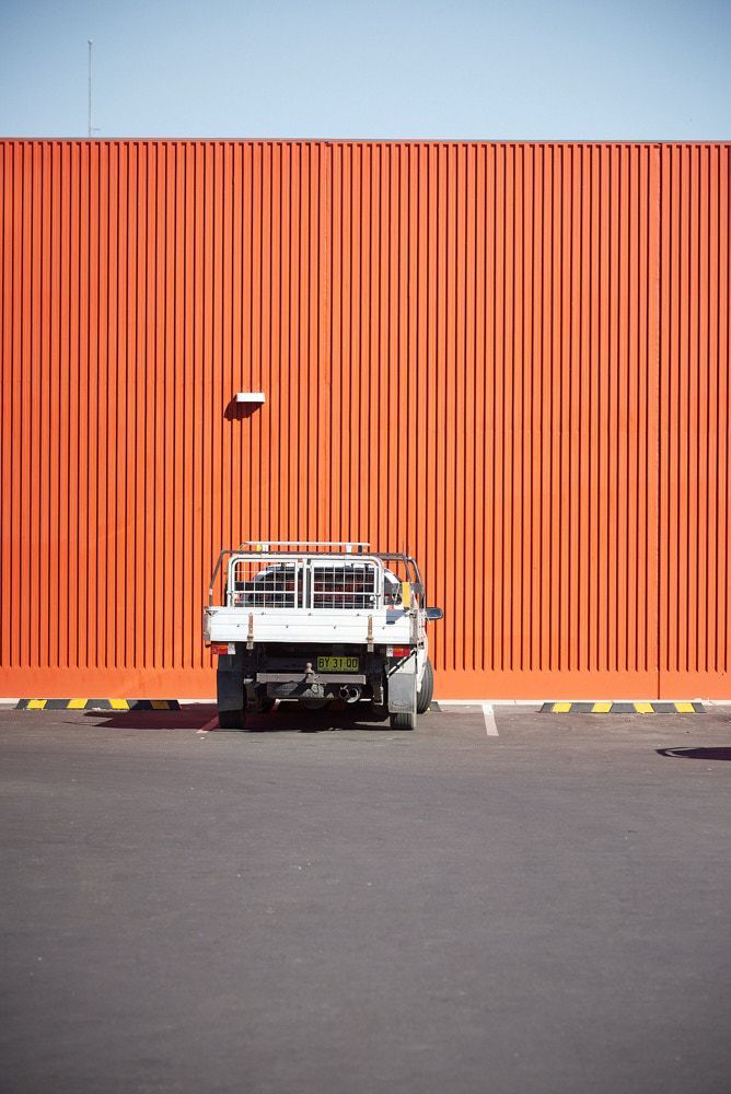 A White Utility Truck Parked in a Lot in Front of a Tall — Quarrell Civil Construction In Congupna, VIC