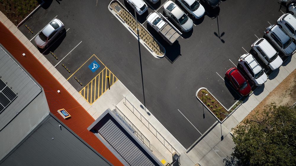 An Aerial View of a Parking Lot Next to a Building — Quarrell Civil Construction In Congupna, VIC