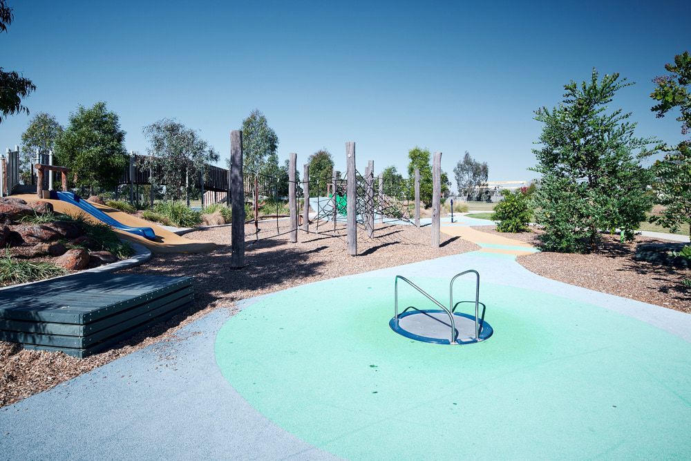 A Modern Outdoor Playground Features a Circular Merry-go-round — Quarrell Civil Construction In Congupna, VIC