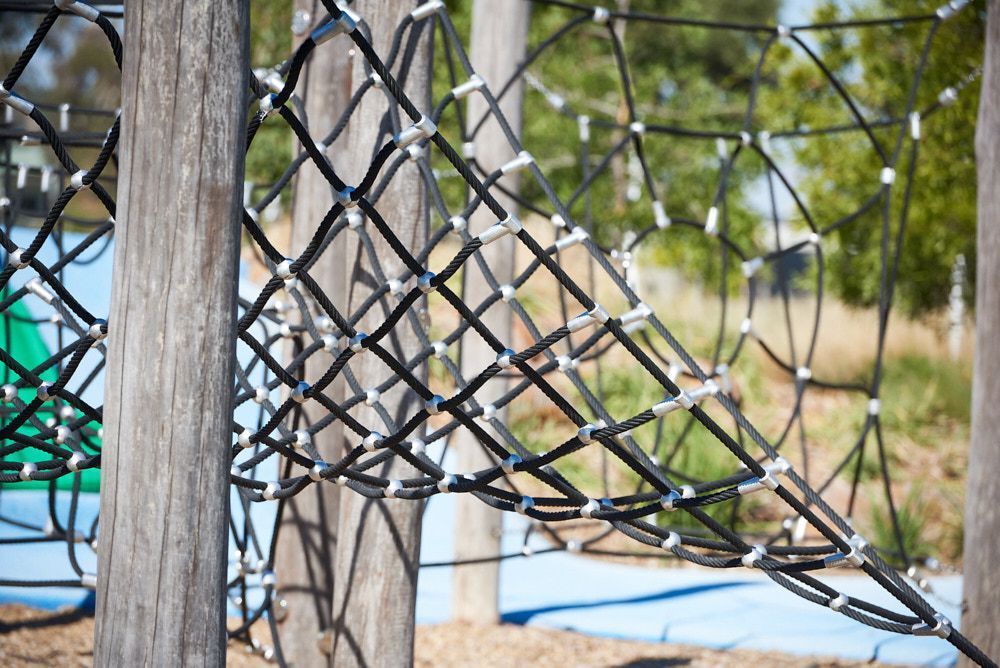 A Rope Climbing Structure in a Playground With Wooden Posts — Quarrell Civil Construction In Congupna, VIC