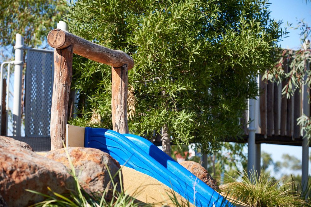 A Blue Plastic Slide Embedded in a Rocky Landscape — Quarrell Civil Construction In Congupna, VIC