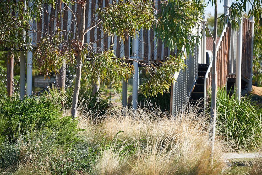 A Wooden Elevated Walkway With Vertical Slat Railings — Quarrell Civil Construction In Congupna, VIC