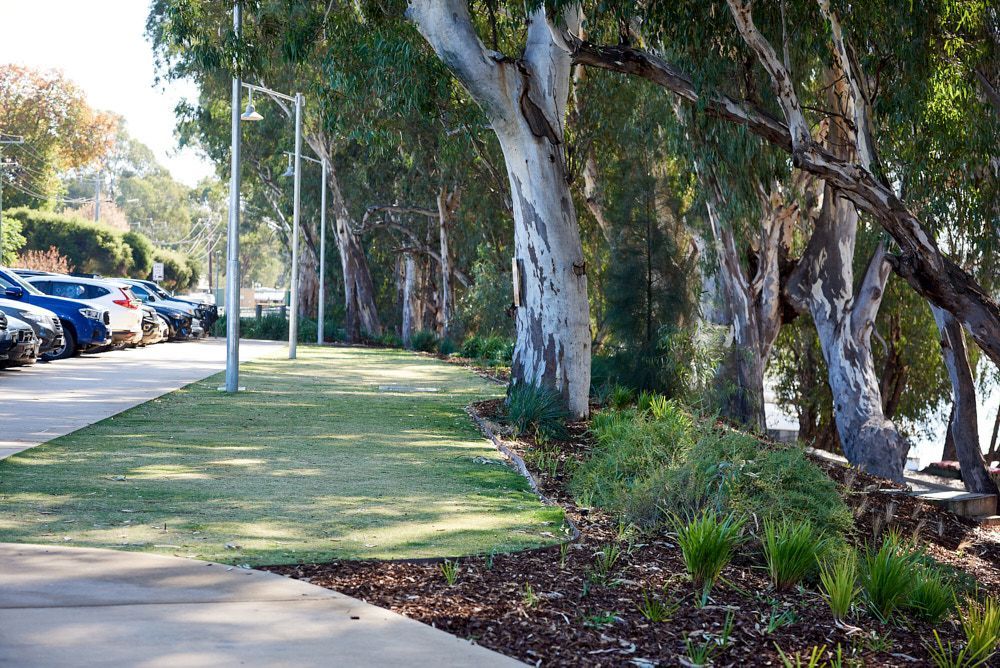 A Paved Parking Area Sits Beside a Green Lawn — Quarrell Civil Construction In Congupna, VIC