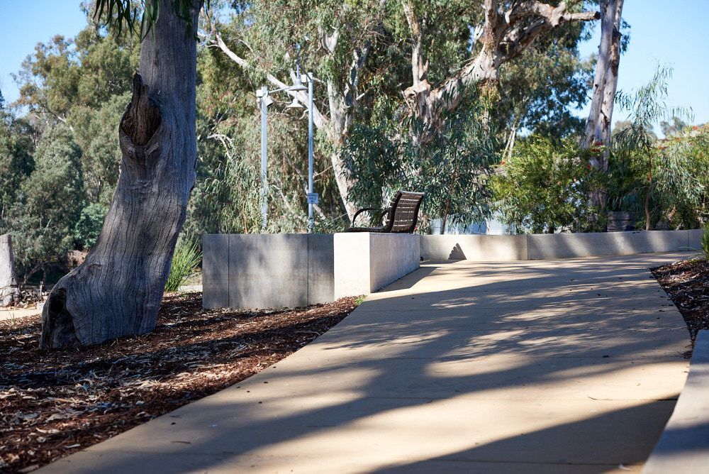 A Paved, Curving Path Leads Past a Concrete Retaining Wall — Quarrell Civil Construction In Congupna, VIC