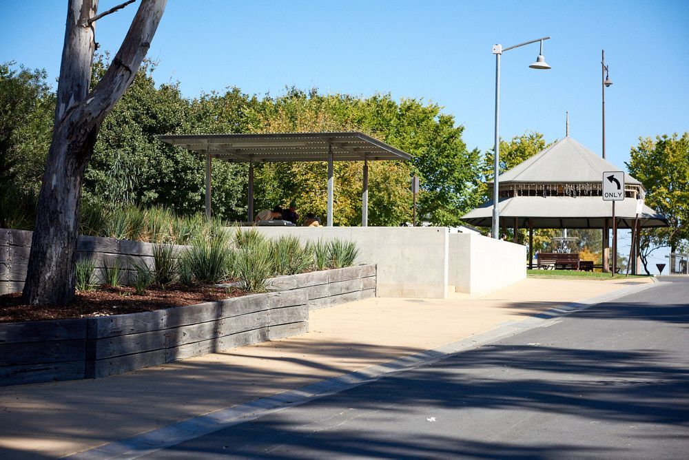 A Sunny Park Path Featuring a Tiered Stone Retaining Wall With Plantings — Quarrell Civil Construction In Congupna, VIC