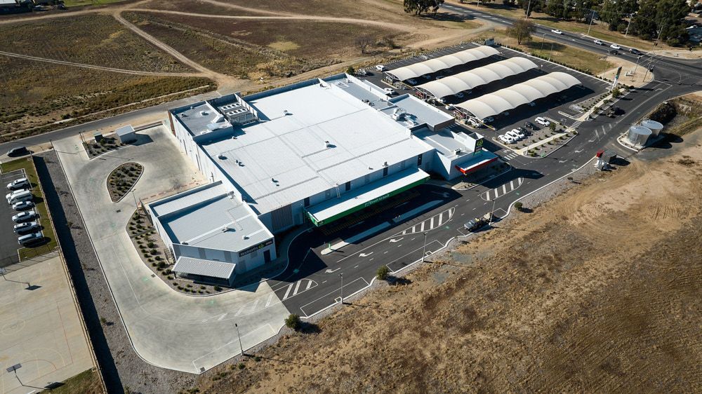 Aerial View Of A Large, Modern Industrial Building With A Curved Driveway — Quarrell Civil Construction In Congupna, VIC