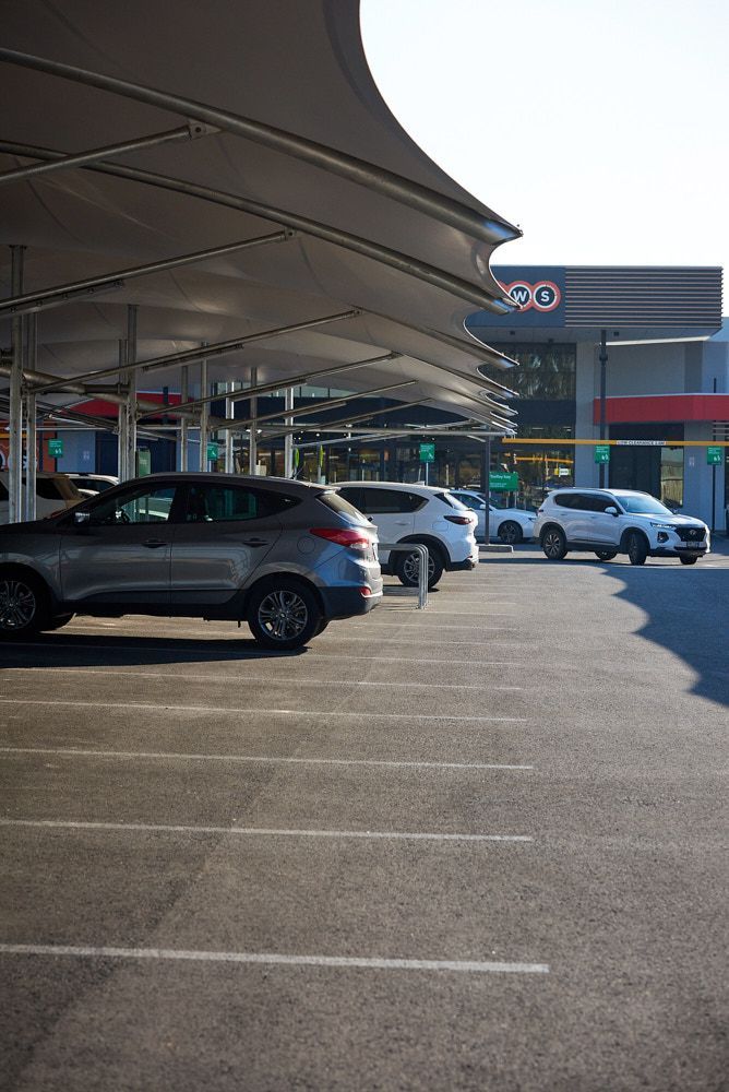 Cars Parked Under A Canopy At A Gas Station — Quarrell Civil Construction In Echuca, VIC