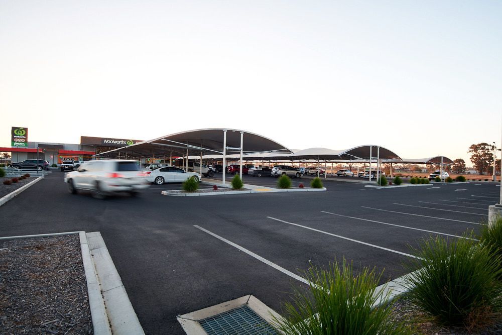 A Parking Lot at Sunset With Covered Parking Bays — Quarrell Civil Construction In Congupna, VIC