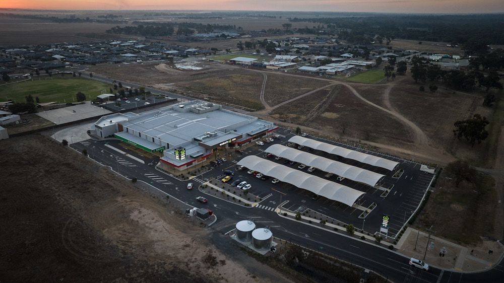 Aerial View of a Commercial Building With a Large Parking Lot — Quarrell Civil Construction In Congupna, VIC