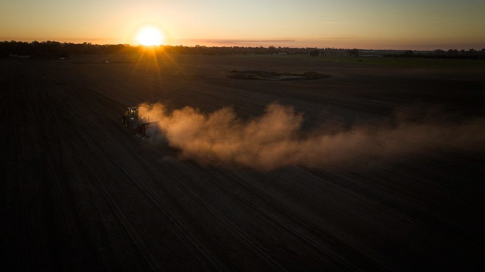 A Tractor Kicks Up Dust in a Large — Quarrell Civil Construction In Congupna, VIC
