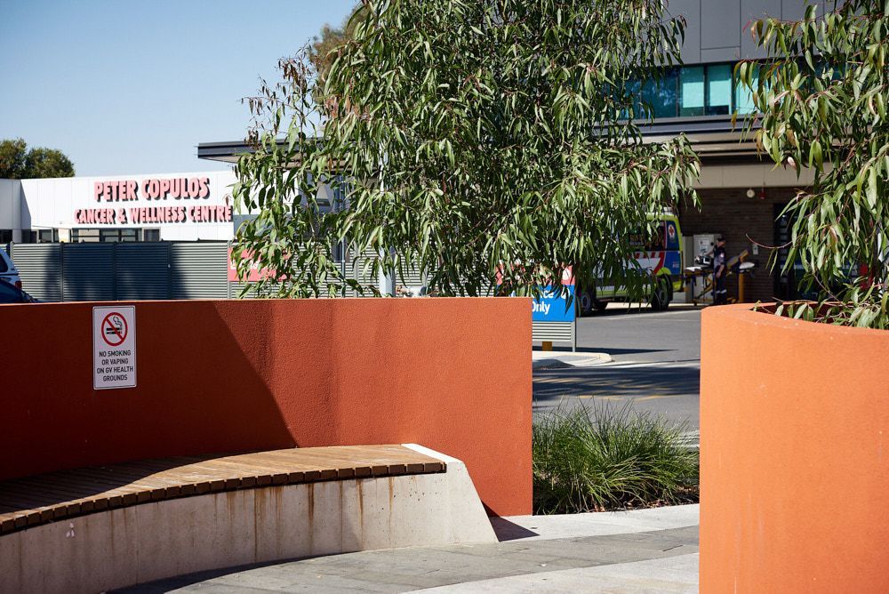 Orange Concrete Planters and Bench in Front of Building — Quarrell Civil Construction In Congupna, VIC