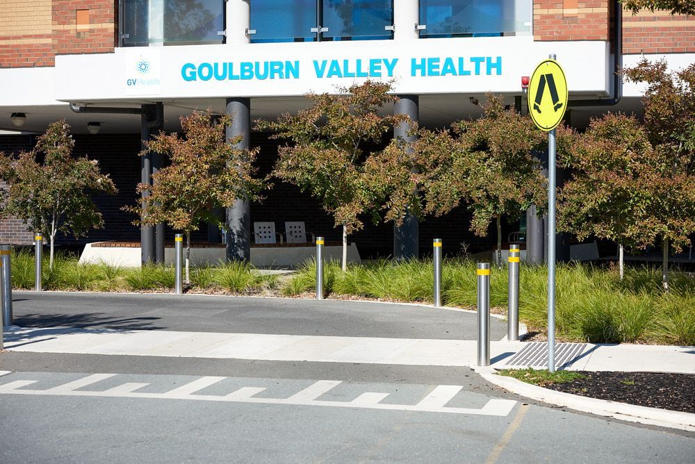 Goulburn Valley Health hospital entrance with pedestrian crossing and roadside sign — Quarrell Civil Construction In Congupna, VIC