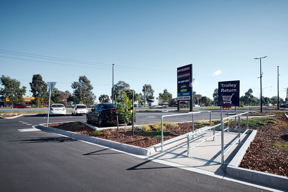 A Paved Parking Lot With a Trolley Return Sign, a Wheelchair-accessible Ramp — Quarrell Civil Construction In Congupna, VIC