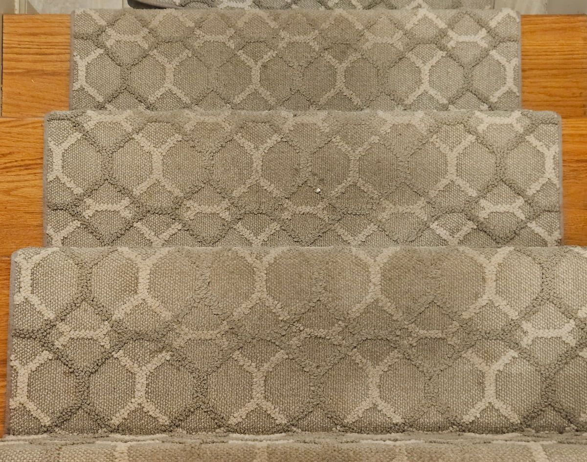Beige-patterned carpet stairs showing heavy foot traffic, soiling and embedded dirt before professional carpet cleaning in Wellesley