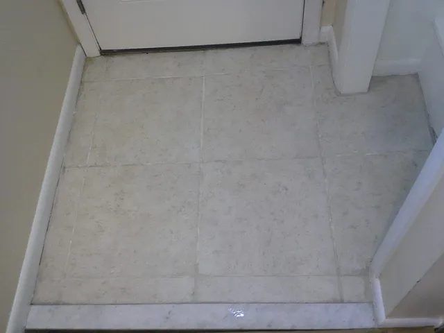Dental office entrance tile and grout in Arlington, MA, after professional cleaning by Sunshine Cleaning Systems