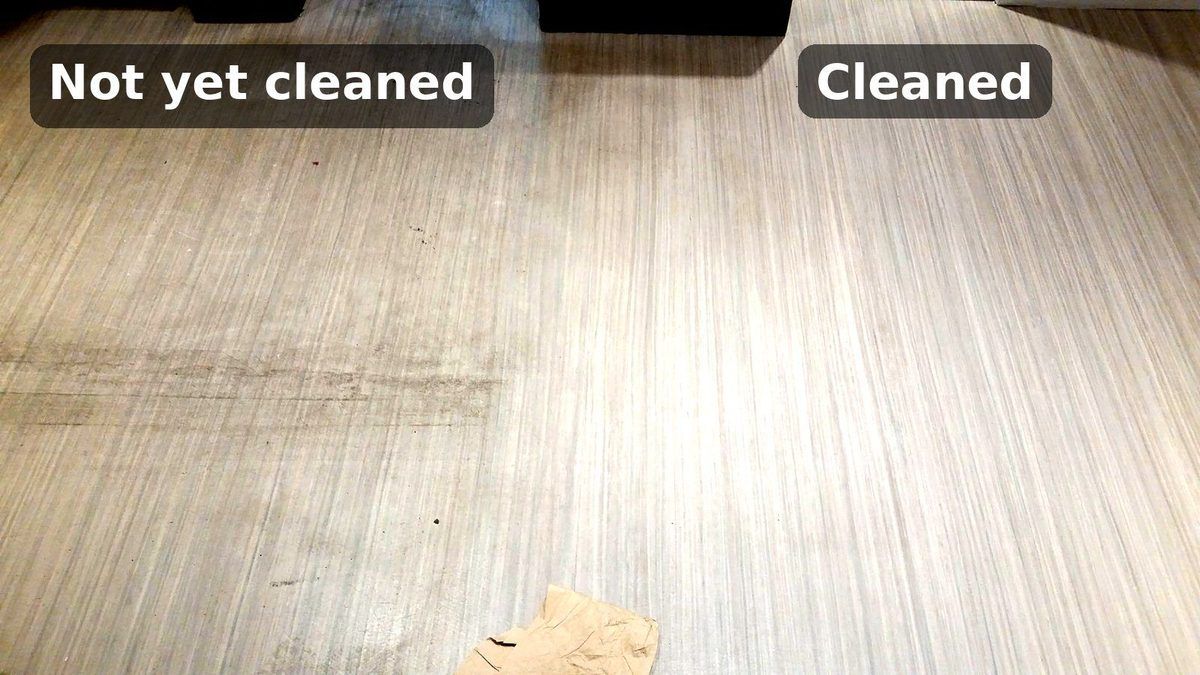 Linoleum floor in a Beverly, MA coffee shop, with the cleaned right side next to the scuffed, uncleaned left side