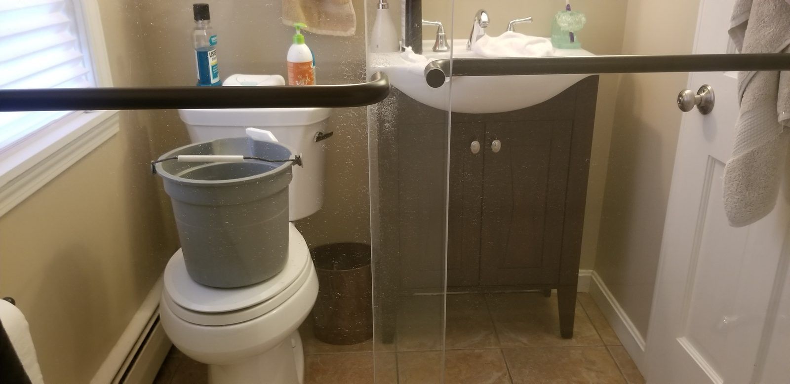 Same shower door after hard water spot removal, much clearer, Ipswich MA