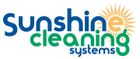 Logo for Sunshine Cleaning Systems, with text in blue and green, a sun graphic.