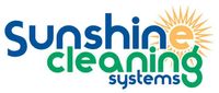 Logo for Sunshine Cleaning Systems, with text in blue and green, a sun graphic.