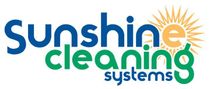 Logo for Sunshine Cleaning Systems, with text in blue and green, a sun graphic.