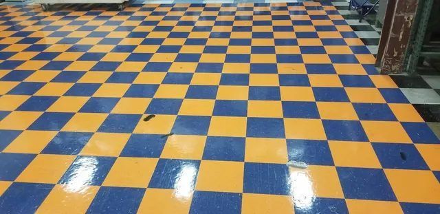 Same VCT floor after a fresh finish was applied, restoring the shine