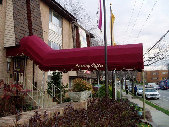 Red awning over a building's entrance, with