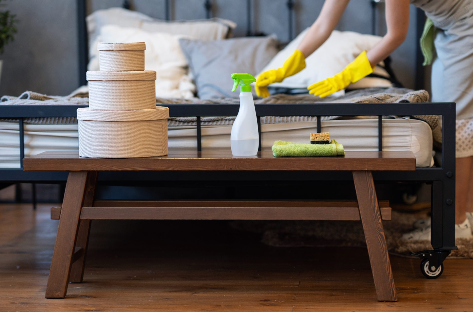 Cluttered garage with storage shelves and tools on concrete floor; white walls, garage door.