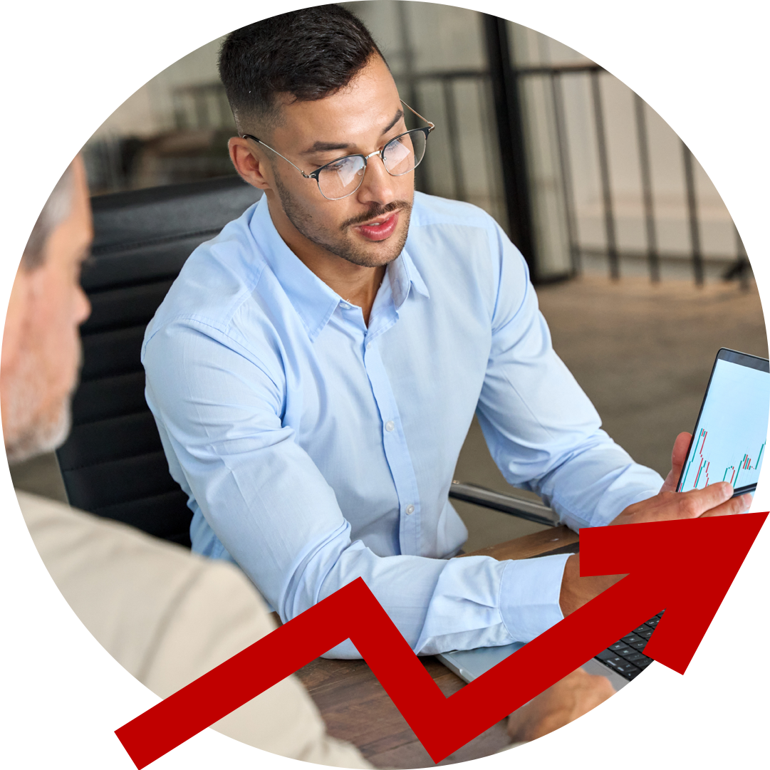 A man is sitting at a table talking to another man with an arrow pointing up.