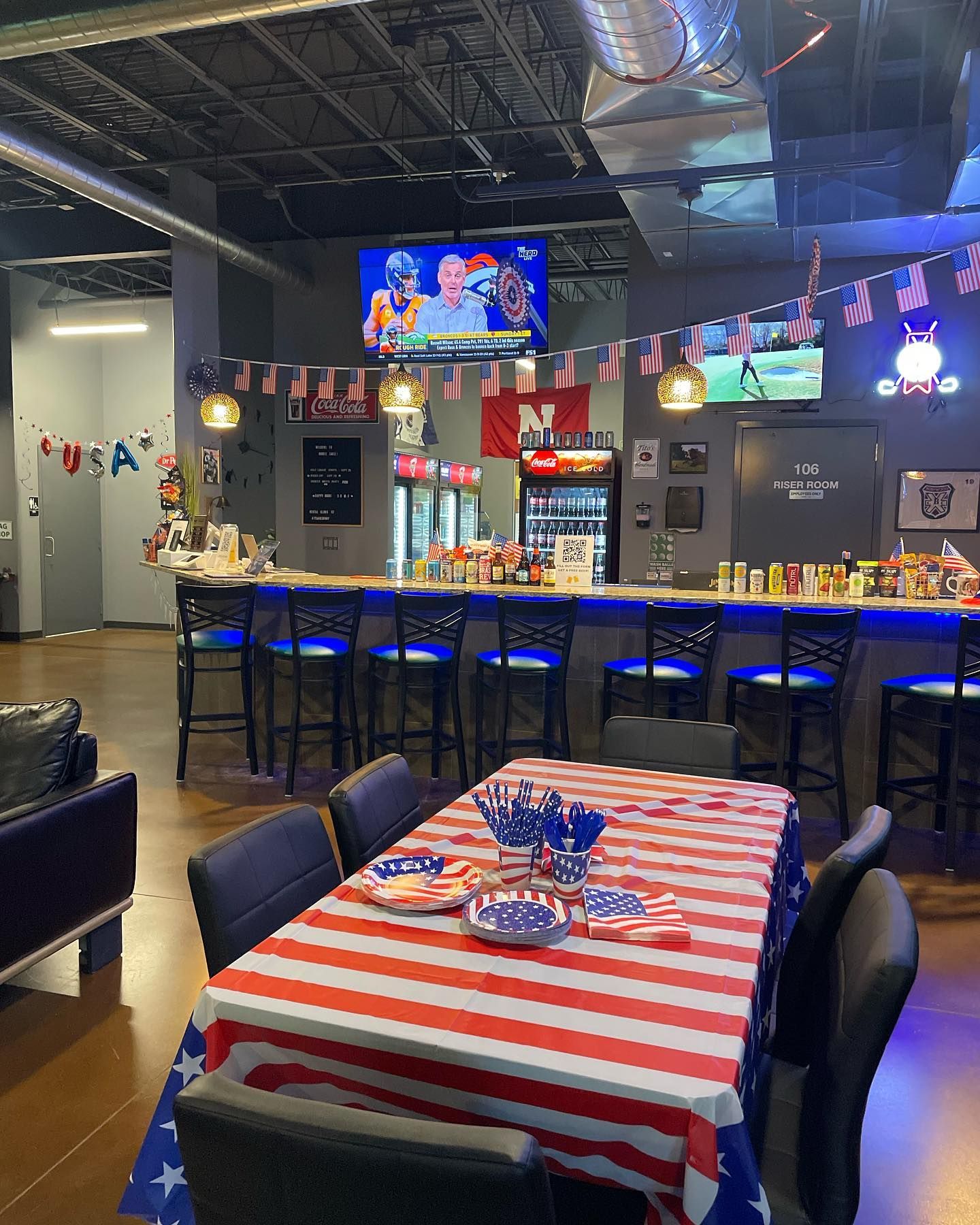 A restaurant with a red , white and blue table cloth