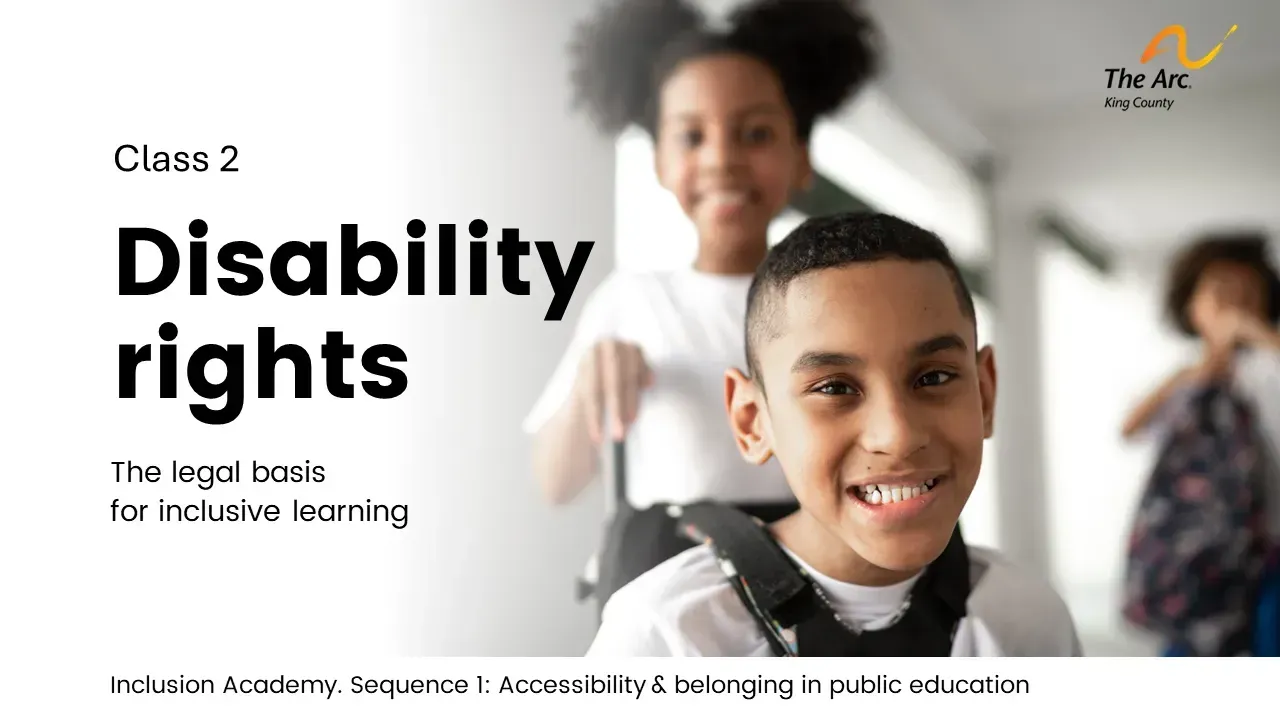 Children smiling, one in wheelchair, with
