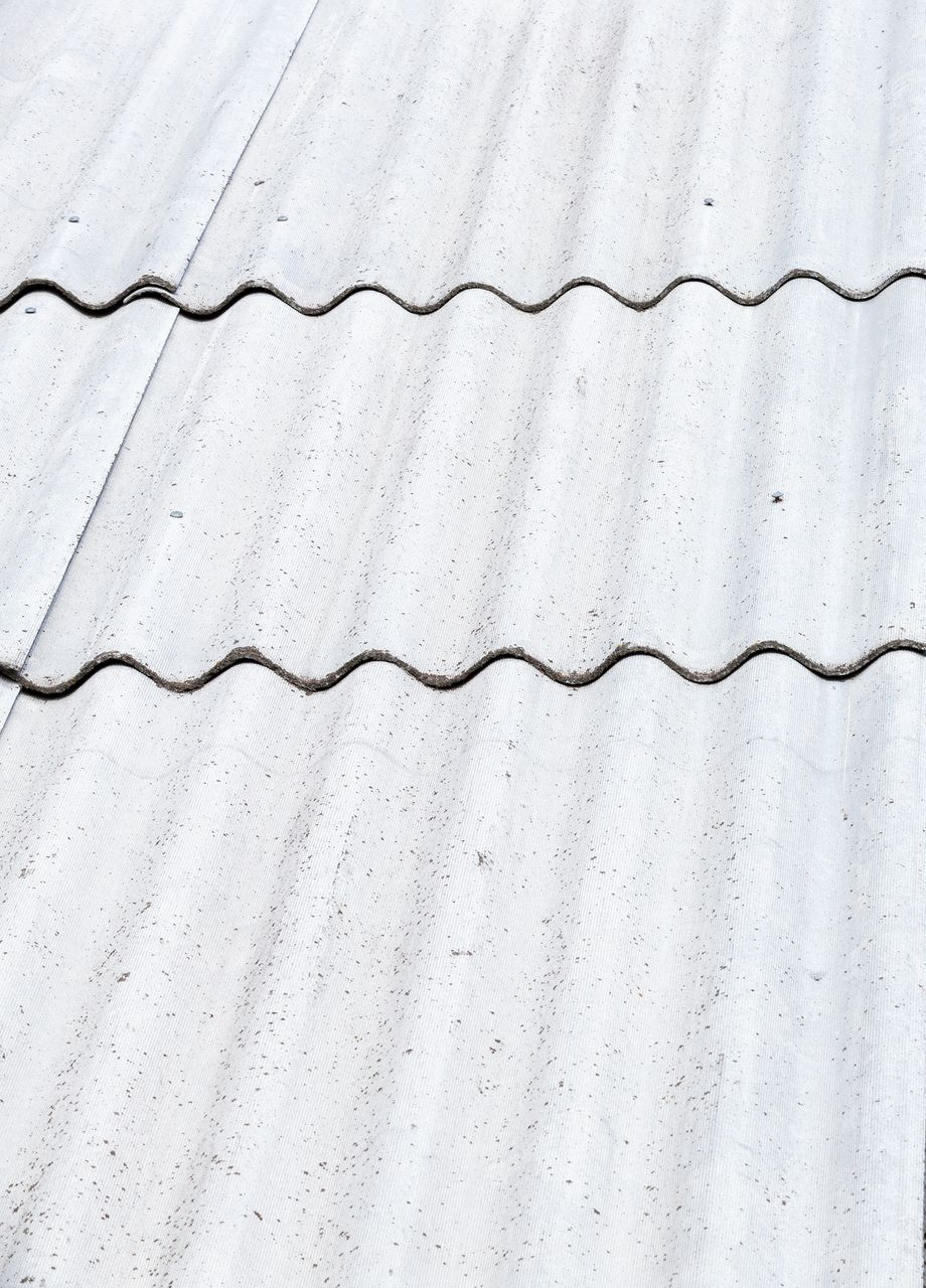 White corrugated roof tiles in sunlight.