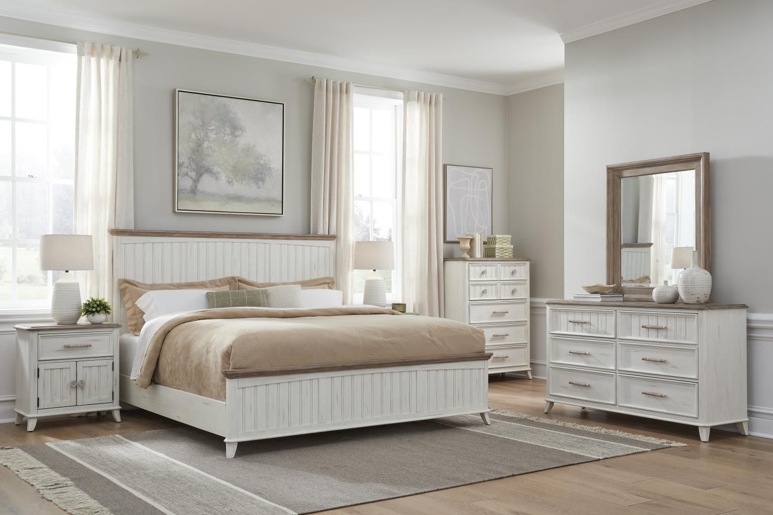 Bedroom set with white and wood-tone furniture, including a bed, nightstand, dresser, and chest of drawers.