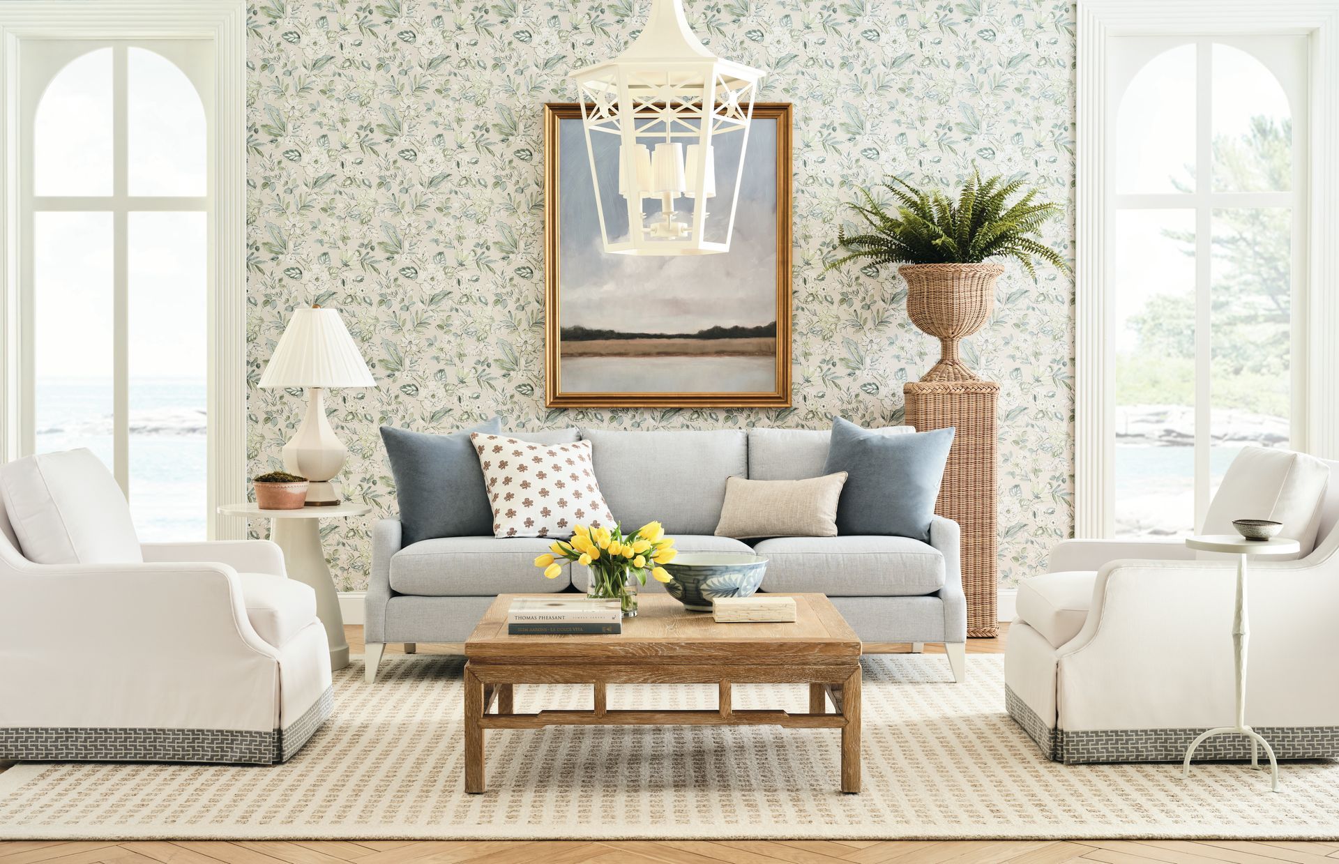 Living room with blue sofa, two armchairs, and a wood coffee table; neutral tones.