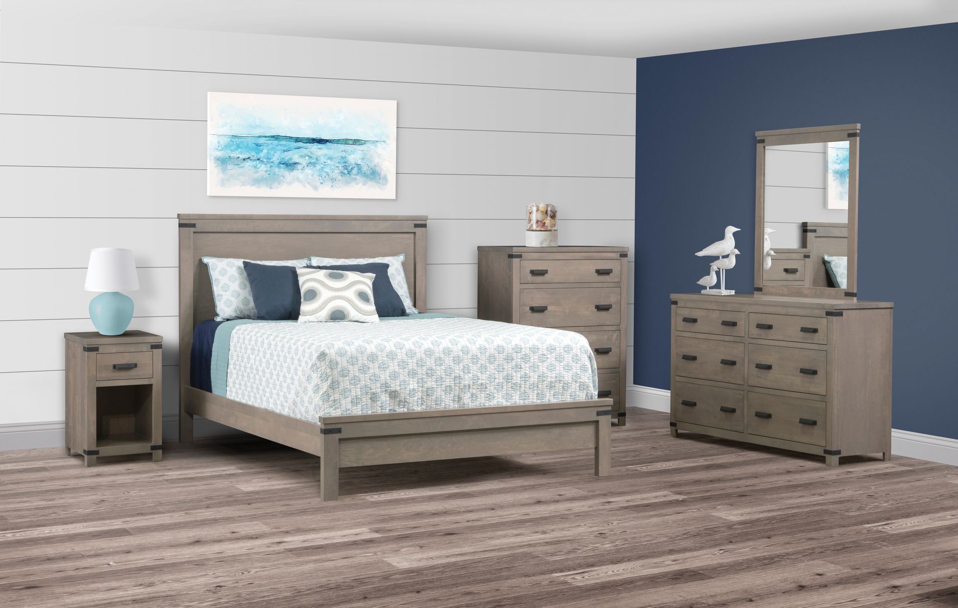 Bedroom set with bed, nightstand, dresser, mirror, and chest. Light wood color. Blue and white accents.
